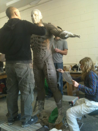 Illustration for article titled Prometheus set photos show what's under the Engineers' robes, plus a never-before-seen character